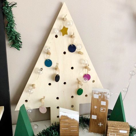 Christmas Tree Pegboards are stocked in the shop! Grab one and add your own lights, ornaments or DIY countdown numbers! #countdownchristmastree #adventtree #woodchristmastree #pegboard Countdown Christmas, Simple Holiday Decor, 3d Christmas Tree, Alternative Christmas Tree, Tabletop Christmas Tree, Diy Ornaments, Wood Christmas Tree, Traditional Christmas Tree, White Ornaments