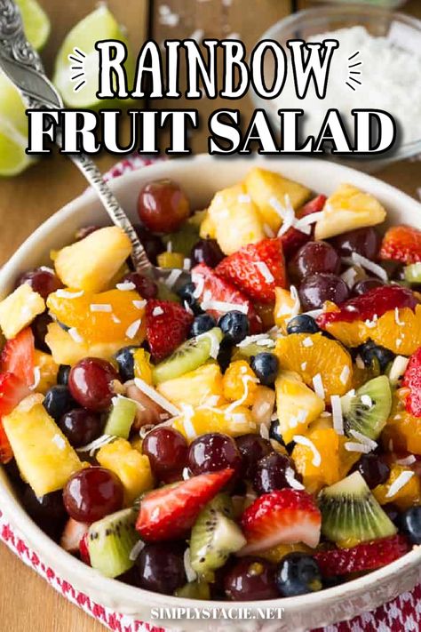 A cream colored bowl filled with rainbow fruit salad and a serving spoon. Fruit Salad With Coconut, Rainbow Fruit Salad, Salad With Honey Lime Dressing, Healthy Fruit Salad Recipes, Fruit Salad With Honey, Fruit Rainbow, Healthy Fruit Salad, Honey Lime Dressing, Fruit Salad Recipe