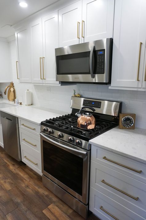 White Kitchen Cabinets Gold Hardware Pull Handles Stainless Steel Appliances Kitchen Cabinets Gold Hardware, Gold Hardware Kitchen, Cabinets Gold Hardware, Gold Kitchen Hardware, Stainless Steel Kitchen Cabinets, Steel Kitchen Cabinets, Smitten Kitchen, New Kitchen Cabinets, Apartment Renovation