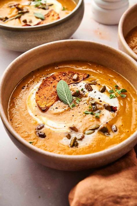 A bowl of creamy pumpkin soup, elegantly garnished with a dollop of cream, a toasted slice, seeds, a sage leaf, and herbs. Easy Honey Glazed Carrots, Sage Soup, Glazed Carrot, Pumpkin Soup Easy, Cooks Kitchen, Creamy Pumpkin Soup, Honey Glazed Carrots, Leftover Pumpkin, Pumpkin Soup Recipe