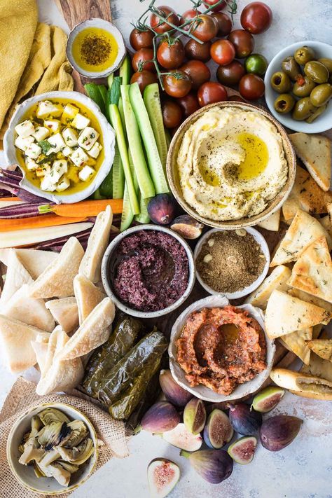 Craving a taste of the Mediterranean, Middle East, or North Africa? Discover how to make the ultimate Mezze Platter, a global cousin to a charcuterie board or antipasto platter, for a taste of the region right in the comfort of your own home. Olive Tapenade Recipe, Mezze Platter, Homemade Pita Chips, Mediterranean Appetizers, Tapenade Recipe, Roasted Eggplant Dip, Homemade Pita Bread, Stuffed Grape Leaves, Marinated Olives