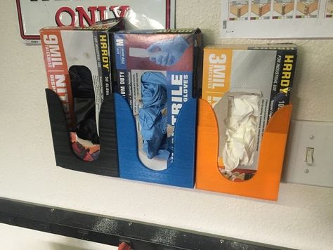 Here's a wall mount disposable glove caddy I made so my boxes stopped falling off benches. It sits 150mm tall to fit in my replicator 2 and is for a harbor freight/Hardy glove brand. The boxes are 120mm x 65mm (125mm and 67mm ID) Scale X and Y depending on your box size. Diy Glove Dispenser, Disposable Glove Holder, Glove Storage, Garage Goals, Sanitation Stations, Dispenser Diy, Factory Architecture, Automotive Technician, Diaper Changing Station