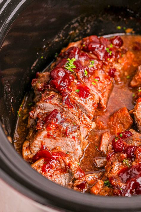 Slow Cooker Cranberry Pork Tenderloin — 🐷🍴🙌🏻 Pork tenderloin is coated in a sweet and tart cranberry glaze before being slow cooked to TENDER and JUICY perfection! The whole berry cranberry sauce in the glaze adds so much texture and FLAVOR! Serve this EASY Crockpot recipe for Thanksgiving, Christmas, or for an elegant tasting meal during the holiday season. Tip - This is a great recipe to use up leftover cranberry sauce you have on hand! Pork Tenderloin Glaze, Cranberry Pork Tenderloin, Crockpot Holiday Recipes, Whole Berry Cranberry Sauce, Cranberry Pork, Cranberry Glaze, Juicy Pork Tenderloin, Slow Cooker Pork Tenderloin, Canned Cranberry Sauce