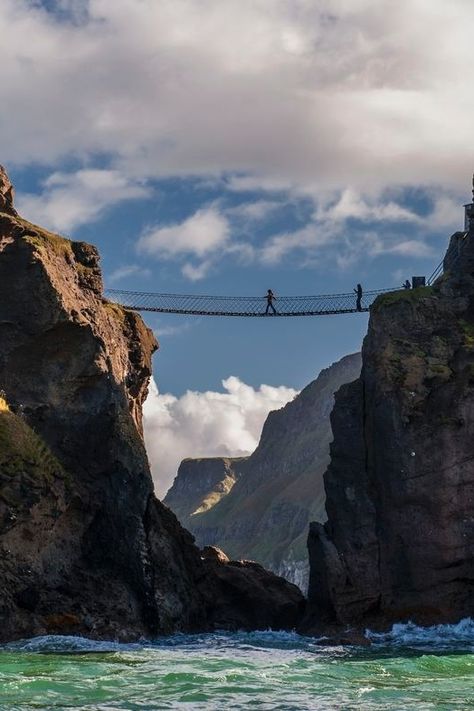 A bridge has swayed from the mainland across to Carrick-a-Rede Island for 350 years, since way back when salmon fishermen frequented this spot to fill their nets. Today, brave explorers have the option to step across Carrick-a-Rede Rope Bridge, 100 feet above the crashing emerald waves... Do you think you could do it? Ireland Bucket List, Best Of Ireland, Rivers And Roads, Rope Bridge, Ireland Road Trip, Adventure Tourism, Vacation Itinerary, Road Trip Destinations, Scenic Photography