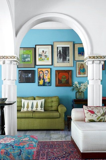 Discover the Delhi house owned and designed by the founder of Good Earth Anita Lal, who has filled it with bold patterns and bright colours on HOUSE - design, food and travel by House & Garden. Delhi House, Blue Paint Living Room, Blue Feature Wall, Blue Couch Living Room, Turquoise Living Room Decor, Painted Living Room Furniture, Picture Arrangements, Indian Living Room, Blue Lounge