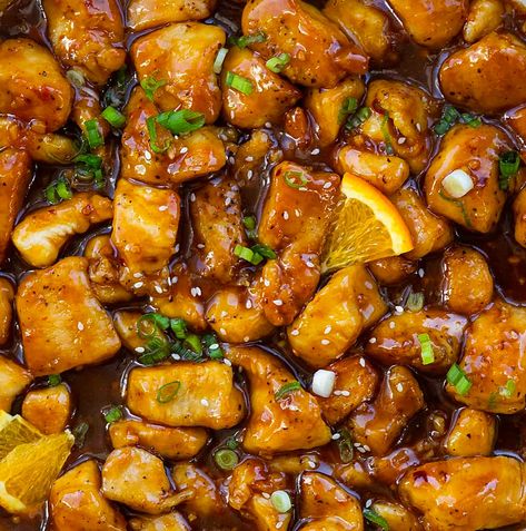 Orange Chicken is bite-sized pieces of chicken pan-fried to golden perfection, smothered in a sweet, tangy orange sauce with a subtle kick. Why not skip the takeout and try making homemade orange chicken instead? Serve it alongside some rice and garnish with green onions for a delicious restaurant-style meal right at home! You can also make the chicken in an air fryer. Chicken In An Air Fryer, Homemade Orange Chicken, Stir Fry Rice, Steamed White Rice, Easy Chinese Recipes, Orange Sauce, Freshly Squeezed Orange Juice, Asian Chicken, Sauce For Chicken