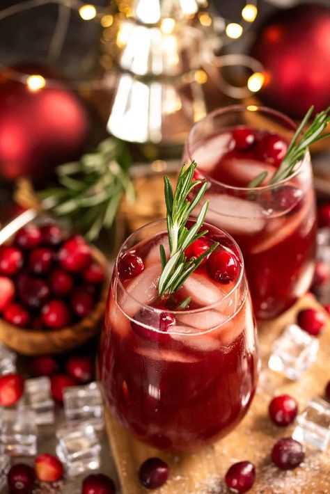 This non-alcoholic Christmas Punch is a bubbly mocktail and kid-friendly punch for large holiday parties. Easy for a large batch holiday drink, this 5-minute recipe features refreshing pomegranate juice, tart cranberry juice, and a splash of sweet citrus. Recipes With Bourbon, Cranberry Kombucha, Christmas Cocktail Recipes, Basil Simple Syrup, Bourbon Cocktail Recipe, Summertime Cocktail, Spritzer Recipes, Bourbon Cocktail, Fall Cocktails Recipes