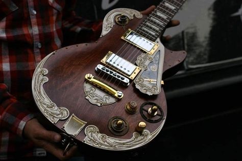 I've seen some pretty ugly steampunked guitars in my day, but this isn't one of them. This one's about as beautiful as they get. French company Wild Customs made this Gibson LesPaul into a steampunk masterpiece.    Check out some of these photos: Steampunk Guitar, Steampunk Tendencies, Unique Guitars, Guitar Gear, Beautiful Guitars, Custom Guitar, Guitar Art, Custom Guitars, Guitar Design