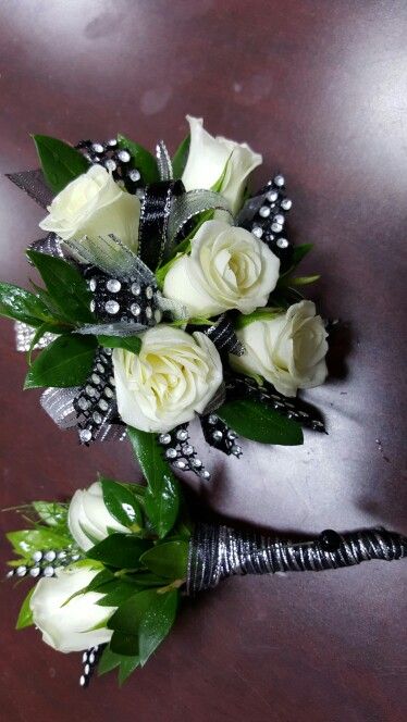 Gallery florist and gifts in mebane nc 919.304.2222 or www.galleryfloristandgifts.com Black White And Silver Corsage, White And Silver Corsage And Boutonniere, White Corsage With Black Ribbon, Black And Silver Corsage And Boutonniere, Black And White Corsage And Boutonniere, Silver Corsage And Boutonniere, Black Corsage Prom, Black And Silver Corsage, Prom Flowers Bouquet