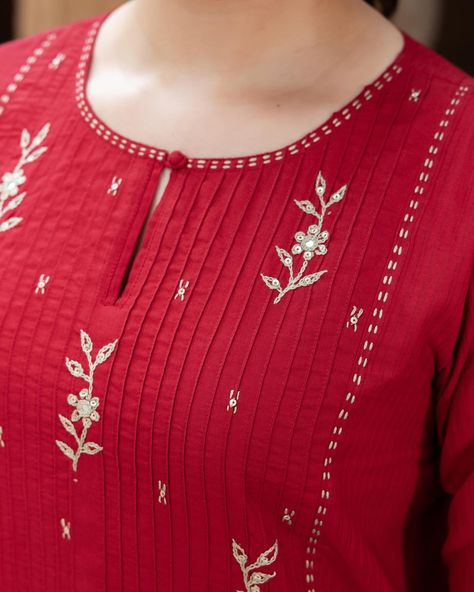 RUDHIRA - New Arrivals! Wearing red means letting people know you feel confident. The tucked yoke gives it a textured dimension, with meticulously embroidered flowers and gudri edging that give it a touch of opulence. [ Cottons Jaipur, Cotton, Kurta, Dress, New Arrivals] #cottons #cottonsjaipur #newarrivals #newcollection #everyday #essentials #dailyfits #comfort #cottonkurtas #breathablefabric #kurta #dress #sleeveless #shirt #handcrated #red #sage #solid #monochrome #cottonsuits #daywea... Neck Designs For Kurta, Embroidery Designs On Kurti, Cottons Jaipur, Embroidery Designs For Kurtis, Red Means, Red Kurti, Button Embroidery, Red Sage, Neck Patterns