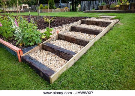 Gravel Steps High Resolution Stock Photography and Images - Alamy Gravel Stairs Garden, Gravel Steps On Slope, Hillside Rock Garden Sloped Yard, Wooden Garden Steps, Gravel Stairs, Gravel Steps, Lawn Steps, Stepped Garden, Sloping Garden Ideas