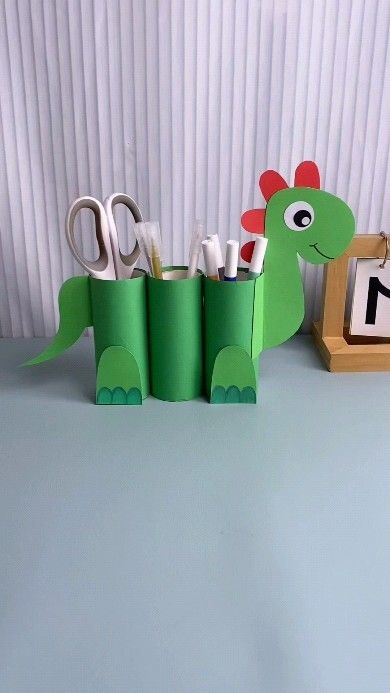 paper crafts creator | Title: "Adorable Dinosaur Pen Holder: Perfect for Kindergarten Handmade Fun!" Hashtags: #KindergartenHandmade #ParentChildHandmade… | Instagram Pen Stand Craft, Pen Stand, Creative Corner, Pen Holder, Pen Holders, Kids And Parenting, Kindergarten, Paper Crafts