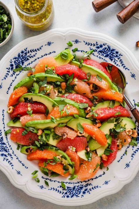 Refreshing and light, this simple salad is made with both grapefruit and oranges, sliced avocado, fresh herbs and a simple vinaigrette. It makes a great side dish, and can also be served as a main dish by adding diced ahi tuna or wild caught salmon. | Zestful Kitchen #grapefruitavocadosalad #avocadosalad #citrussalad #grapefruitsalad #orangesalad Taco Side Dishes, Side Dishes For Salmon, Grapefruit Salad, Sliced Avocado, Simple Vinaigrette, Avocado Salad Recipes, Citrus Salad, Simple Salad, Ahi Tuna