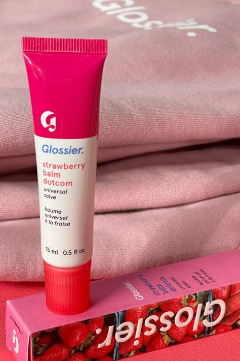 Meet Glossier Strawberry Balm Dotcom! 🍓 The iconic do-everything formula now in a sweet, juicy strawberry flavor with a jammy red tint. This balm nourishes lips with a blend of heavy-duty moisturizers and antioxidants, perfect for keeping dry, chafed skin at bay. Its thick texture and water-binding properties lock in moisture for soft, hydrated lips. #Glossier #StrawberryBalmDotcom #LipCare Glossier Strawberry Balm Dotcom, Glossier Strawberry, Sephora Stuff, Chafed Skin, Back To School Makeup, Hydrated Lips, Strawberry Lip Balm, Birthday Things, Bondi Sands