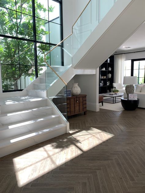 Exactly the stair design we like. Wall panneling on their stairs and the same windows. Glass Balustrade with Brass trim Glass Balustrade Stairs, Stairs Background, Luxury Basement, Big Glass Windows, Glass Stair, Wall Stairs, Front Stairs, White Staircase, Stair Design