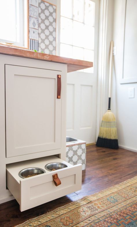 A low drawer kitted with stainless bowls keeps cat food safe from hungry dogs. Around the corner, rerouting the original laundry hookups allowed for an easy-fill water bowl. #laundryroom #mudroom #boho #modernlaundryroomideas #remodel #bhg Family Laundry Room, Pet Nook, Cat Food Dish, Tiny Laundry Rooms, Dish Storage, Kitchen Hacks Organization, Small Laundry Rooms, Small Laundry Room, Small Laundry