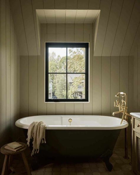 A peek into this stunning Canadian home with drool-worthy living spaces Bathroom Slanted Ceiling, Ashley Montgomery Design, Ashley Montgomery, Tub Small Bathroom, Luxurious Bathtubs, Standing Tub, Narrow Bathroom, Corner Tub, Slanted Ceiling