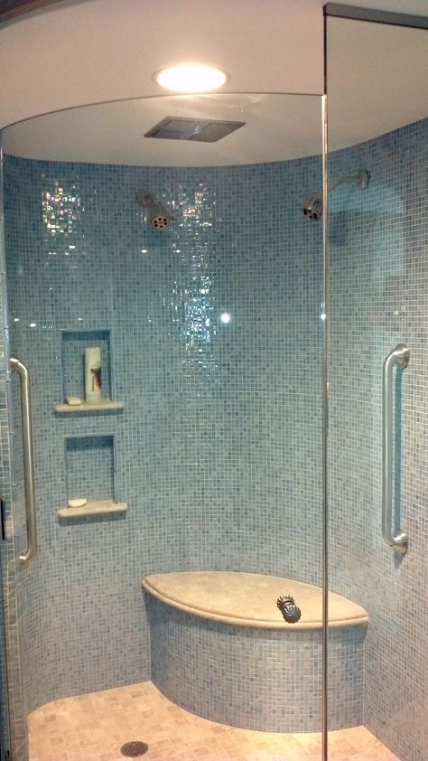 iridescent blue glass tile shimmers on curved shower walls! Iridescent Tile Bathroom, Iridescent Bathroom, Glass Tile Bathroom Wall, Blue Shower Tile, Glass Tile Bathroom, Glass Shower Wall, Blue Glass Tile, Iridescent Tile, Shower Wall Tile