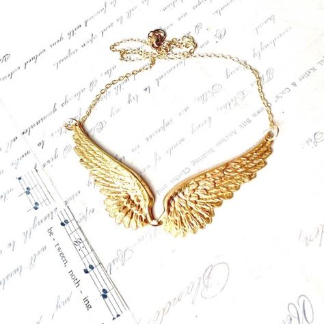 Angel Wings Symbolize Good Luck And Protection. This Beautiful Necklace Features Two Golden Wing Charms. The Wings Are Attached By A Ring To Create Individual Flutter-Like Movement. This Necklace Is Perfect For Layering Or Wearing Alone As A Statement Piece. These Golden Brass Wings Hang From An 18 Inch Gold Plated Link Chain. Each Wing Measures Approximately 2” Long For An Approximate Of 4” Total. Brass With Gold Plate Chain Elegant Gold Wing-shaped Jewelry, Elegant White Gold Wing-shaped Necklace, Elegant Gold Winged Necklace, Elegant Wing-shaped Yellow Gold Necklace, Angel Wings Necklace, Gold Wing-shaped Sterling Silver Necklace, Ar Accessories, Golden Wings, Wing Jewelry