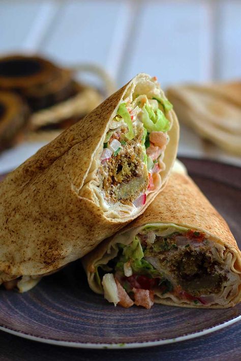 Falafel Wrap ➤ Quick, Easy and Meal Prep-Friendly! | Gourmandelle Falafel Wrap Recipe, Pita Wrap, Best Lunch Recipes, Falafel Wrap, Vegan Wraps, Chickpea Recipes, Tzatziki Sauce, Wrap Recipes, Tahini