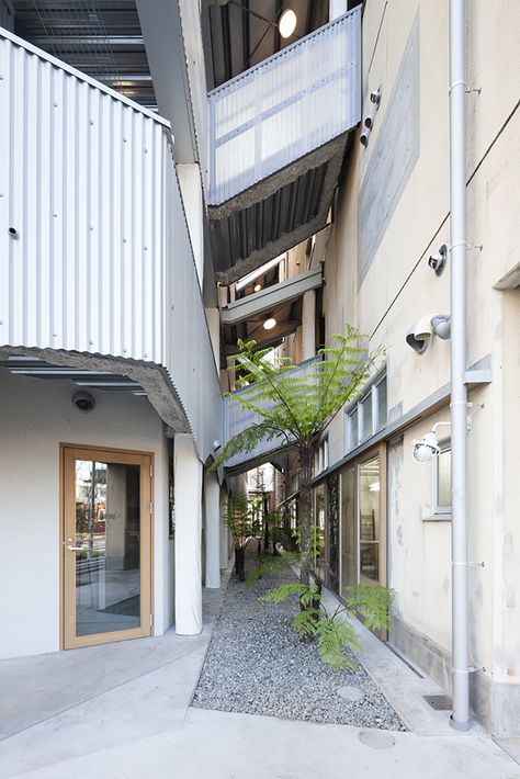 Business hotel in Kanoya, the central city of Japan's southernmost peninsula. The idea was to build a business hotel on a low budget, which was necessary for the current situation, and to provide an opportunity for the city, which is conspicuously lacking in tourism resources, where vacant lots stand out like insects. The parking lot behind the hotel was also acquired as a site, and iand an extension building was constructed to provide the necessary floor space without demolishing the existing b Business Hotel, Build A Business, Hotel Architecture, Central City, Adaptive Reuse, Urban Architecture, Building A Business, Budget Hotel, Low Budget