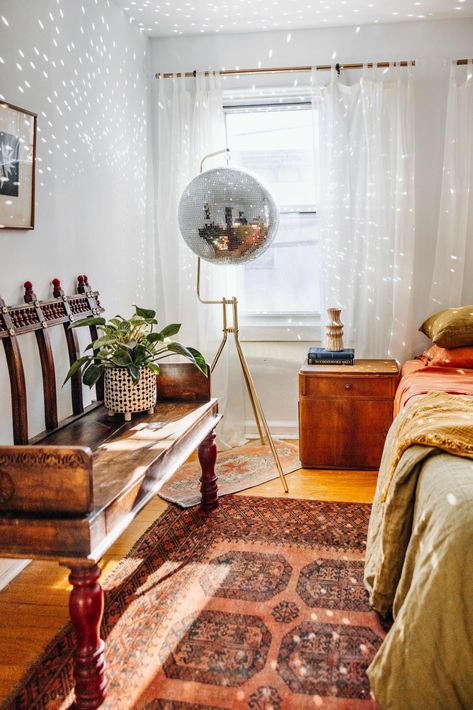 See Inside This Artist and Designer’s Philly Rowhome | Apartment Therapy Philly Rowhome, Vintage Disco Ball, Rust Accents, Apartment Lounge, Disco Ball Light, Vintage Disco, Wood Magazine, Globe Decor, Night Table