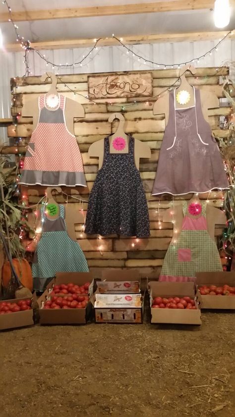 Apron display ideas Displaying Aprons Craft Fairs, Display Aprons At Craft Show, How To Display Aprons At A Craft Show, Apron Display Ideas Craft Fairs, Apron Display Ideas, Apron Display, Deli Decor, Market Stall Display Ideas, England Kitchen