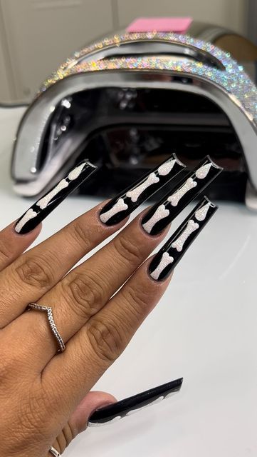 ✨Licensed✨ Nail Artist | Nail’ d By Juli on Instagram: "the best part of these spooky nails 🖤🦴 #tucsonnails #tucsonbeauty #phxnails #arizonanails #nailtech #tucsonnailtech #aznails #glitternails #nails #instagramnails #shortnails #taperedsquarenails #nailprocess #glowinthedarknails #acrylicnails #blingnails #coffinnails #nailreels #nailgoals #fyp #spooky #glossynails #baddienails #longnails #nailfeed #nailgasm #prettynails #valentinonails #halloweennails #spookynails" Long Black Halloween Acrylic Nails, Bling Spooky Nails, Xxl Halloween Nails, Halloween Xxl Nails, Spooky Nails Short, Halloween Nails Acrylic Skeleton, Halloween Nails Long, Black Nails With Skeleton, Halloween Nails Square