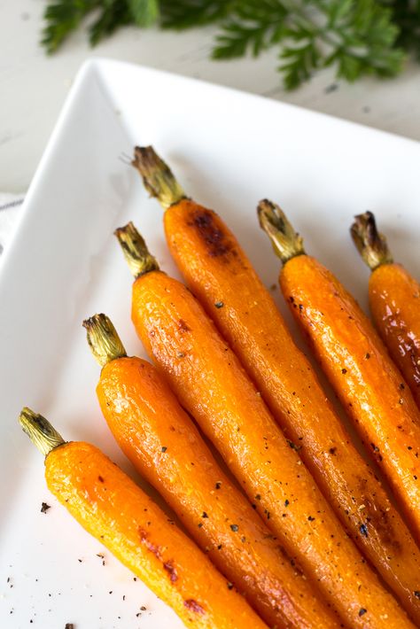 These Roasted Carrots with Honey Butter Glaze are so simple to make and taste amazing. Cooked on a pan in the oven then brushed with melted honey butter, they’re slightly sweet but still healthy. This recipe is perfect for special meals like Thanksgiving or as an easy addition to your weeknight dinner. #roastedcarrots #roastedveggies #veggierecipe #healthyeating #holidaymeal What To Serve With Quiche, Roasted Carrots With Honey, Honey Butter Glaze, Carrots With Honey, Sheet Pan Meals, Meatloaf Dinner, Honey Roasted Carrots, Butter Glaze, Pan Kitchen