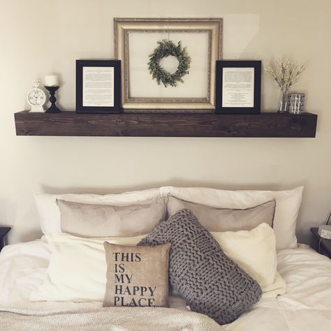 Are you looking for ways to spruce up your bedroom? Well, adding floating shelves can be an excellent way to do so. These shelves are not only functio... No Headboard Shelf Above Bed, Floating Shelf Over Master Bed, Floating Shelf Headboard, Floating Shelves Behind Bed, Shelf Above Master Bed, Overbed Shelf, Above Bed Decor Master Farmhouse, Above The Bed Shelf, Bedroom Shelf Decor Above Bed