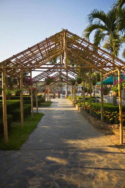 Walkway in the garden. Walkway in the garden with the bamboo roof in rural styles royalty free stock images Path Way Design, Path Way, Bamboo Roof, Light Garden, Garden Walkway, Garden Outdoor, Concept Architecture, Walkway, In The Garden