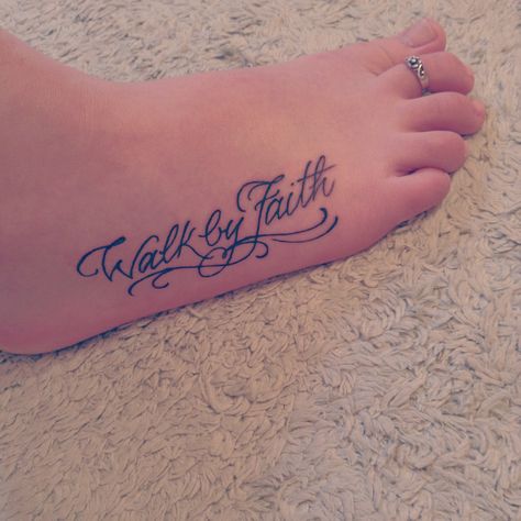 "For we walk by faith, not by sight." Tattoo Walk By Faith, Small Rose Wrist Tattoo, Walk By Faith Foot Tattoo, Faith Foot Tattoos, Faith Cross Tattoos, Shoulder Tattoo Quotes, Star Tattoo On Wrist, Ankle Foot Tattoo, Rose Neck Tattoo