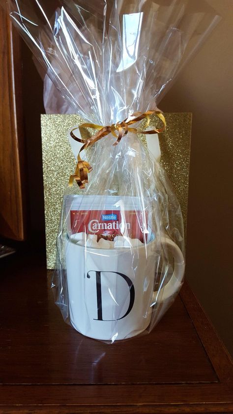 Monogram mug from Chapters, hot chocolate, and marshmallows wrapped in cellophane. Sparkly gift bag from Bath & BodyWorks. Wrapping Mugs Ideas, Wrap Mug Gift, Cellophane Gift Wrapping Ideas, Wrapping Coffee Mugs Gift, Wrapped Christmas Mug, Gift Basket Wrapping Cellophane, In The Beginning God, Bath And Bodyworks, Christmas Gift Wrapping