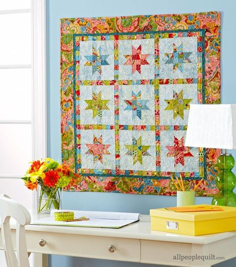 Add some zing to spring with a high-contrast wall hanging. Piece the entire  star-studded quilt from simple  squares and rectangles. Scrappy sashing pops  against the mottled blue background. Quilted Wall Hangings Patterns Free, Small Quilting Projects, Quilt Wall Hangings, Wall Hanging Quilts, Quilted Wall Hangings Patterns, All People Quilt, Light Quilt, Hanging Quilts, Quilt Wall