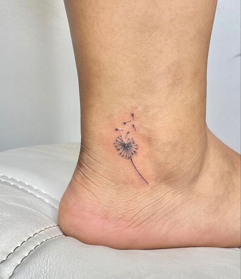 fine line tattoo of a dandelion in the wind on an ankle Small Tattoos Dandelion Ideas, Dandelion Ankle Tattoo, Wind Tattoo Ideas, Fine Line Ankle Tattoo, Blowing Dandelion Tattoo, Wind Tattoo, Blowing Dandelion, Getting Your Ears Pierced, Bestie Tattoo