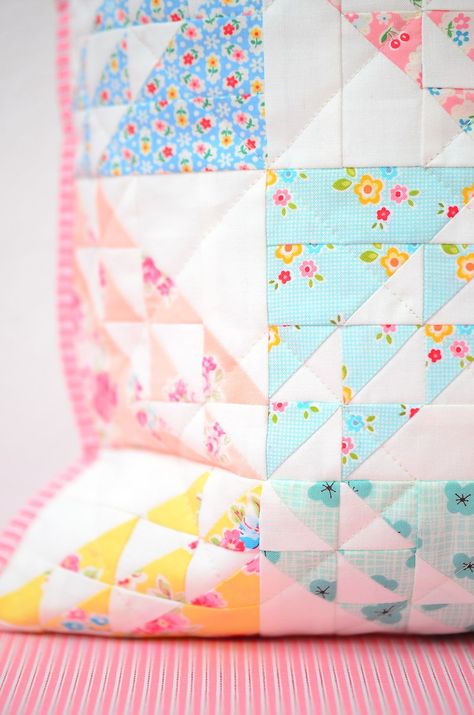 The Spring Meadow Spring quilt patterns combine reproduction prints with cute little florals, basic pastels, a simple piecing technique and a sense of nostalgia... This quilty project comes in two sizes - a 16" pillow or mini quilt and a lap quilt measuring 64" x 72". Check out my blog at ellisandhiggs.com for some fun pattern add-ons! Nadra Ridgeway, ellis & higgs. Spring quilt, Spring quilt pattern, Spring quilt projects, Quilted Pillow, Quilt Pattern, Half Square Triangles, HSTs. Pastel Quilts Ideas, Spring Quilt Patterns, Pastel Quilts, Pillow Quilt, Mini Quilt Patterns, Basic Quilt, Spring Quilts, Spring Meadow, Painted Rocks Kids