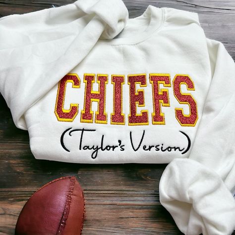 taylors verison, superbowl, chiefs sweatshirt, glitter sweatshirt, embroidered, womens sweatshirt, kansas city, game day, girls sweatshirt Show your team pride with a touch of sparkle.  This glitter sweatshirt will have you day ready. Chiefs lettering is embroidered using a glittery red fabric, so this sweatshirt really sparkles. **Materials** Made with a soft 50% cotton and 50% polyester sweatshirt in white.  **Sizing** Sweatshirts are unisex size.  See sizing chart for measurements. Chiefs Embroidery, Chiefs Sweatshirt, Christmas Merch, Taylor Swift Playlist, Taylor Swift Images, Chiefs Shirts, Taylor Swift Birthday, Taylor Swift Tour Outfits, Girls Sweatshirt