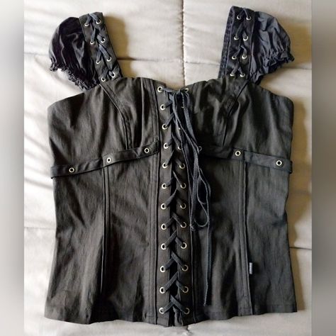 I Bought This Brand New At Least Fifteen Years Ago (Maybe More!) And Wore It Maybe Once. It's A Black Corset Style Top With Lightweight Plastic Boning In It. It Won't Really Reduce Your Waist Size, But It Will Give You A Lovely Shape. The Fabric Is A Solid Black Fabric With Cap Sleeves Attached To The Straps. It Has A Zipper Up The Back And Laces Up The Front. It's A Size Xxl. The Chest Measures About 19", The Length Is About 23", The Waist Is About 16.5", And About 18.5" At The Bottom. Those Me