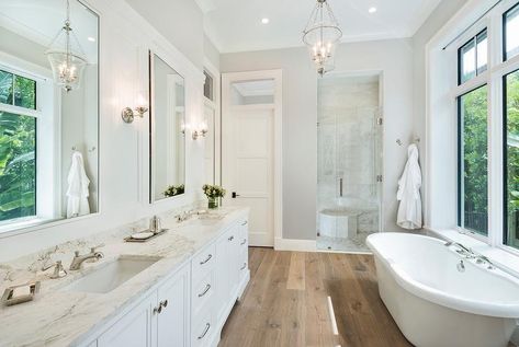 Nothing beats a classic small freestanding bathtub. Wooden floors help to provide a more rustic feel to any home. In a contrast, a small freestanding bathtub, such as the one pictured here, helps to provide a touch of modernity. This is proof that you donât need a large bathtub to provide a large statement in your bathroom. Wood Floor Bathroom, Bathroom Wood, Best Kitchen Design, White Wood Floors, Wood Floors Wide Plank, Transitional Bathroom, Bathroom Photos, Trendy Bathroom, Bad Design