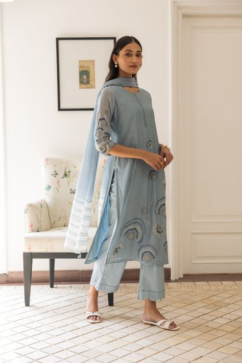 The Blue Embroidered Kurta Set is crafted in soft muslin cotton, featuring intricate thread embroidery florals that exude timeless allure. Complete with scalloped edge pants and a dupatta adorned with a soft ombre and linear print. Ombre Dupatta, Dupatta Styling, Design For Dress, Plain Suits, Cotton Suit Designs, Patiala Suit Designs, Embroidered Dresses, Blue Kurta, Simple Kurti