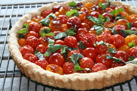 One of my favorite recipe resources is Food and Wine Magazine. Of course, I first choose a recipe by what appeals to me, but then I check to see if it is listed as a Staff Favorite by the magazine.… Cherry Tomato Pie, Cherry Tomato Tart, Wine Magazine, Tomato Tart, Tomato Pie, Wine Sale, Greek Cooking, Perfect Pies, Sweet Pie