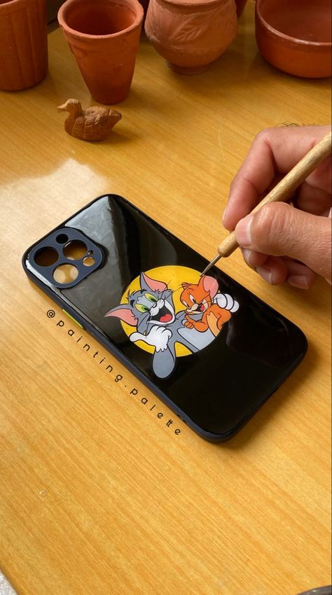 Tom and Jerry. One of my favourite show broadcasted by Cartoon Network Channel. I still remember watching it for hours. 😀 Thought of making a mobile case recalling the best cartoon show of all time. 👌 @painting.palette . . Model - iPhone 13 Pro Max (Any model is possible) Dm to customise your own cover. @painting.palette 🌸♥️ Few pointers about the quality of the product. 🔸The Surface is glossy finished. 🔸Water and Shock Resistant Cover. 🔸Unbreakable surface unlike Glass. 🔸The colour won’t Cartoon Mobile Cover, Mobile Back Cover Painting, Mobile Cover Painting Ideas, Tom And Jerry Phone Case, Mobile Cover Diy, Mobile Cover Painting, Phone Cover Painting, Making A Mobile, Mobile Cover Design