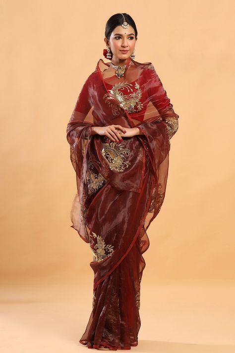 Maroon tissue saree in bold statement motifs done in zardozi and cutdana. Comes with blouse. Components:2 Embroidery Sleeve Type: Half Fabric:Tissue Color:Maroon Zardozi and cutdana gold buttas Note: Blouse worn by the model is not for sale - Aza Fashions Maroon Saree, Rajputi Dress, Simple Saree Designs, Indian Bride Outfits, Traditional Blouse Designs, Black Color Hairstyles, Tissue Saree, Indian Saree Blouses Designs, Color Hairstyles