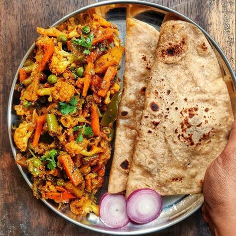 Breakfast today... Chapathi with Mixed Vegetables sabzi... The perfect dish i can think of when I want to clear my fridge..😃... Had Small piece of cauliflower, Small piece of cabbage,a capsicum,2 carrots n few beans lying in fridge.... Tossed everything together with few spices n loving the way how colorful my plate looked ... Yes it was very tasty too...😋.. recipe in highlights #eattherainbow ..... .... #smithakalluraya #Roti #chapati #rotisabzi #curry #mixedveggies #northindianfood #sabzi # Corn Sandwich Recipe, Jowar Roti, Spinach Sandwich, Mango Pickle, Easy Sandwich Recipes, Millet Recipes, Roti Recipe, Sandwich Bread Recipes, My Plate