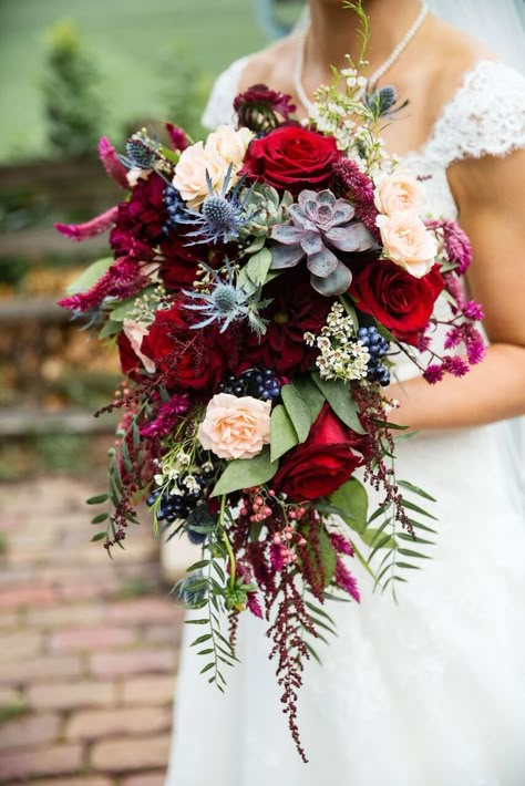 Cascading boho bouquet including pepper berries, succulents, blue thistle, red roses, and privet berries Pepper Berries, Privet Berries, Vintage Bridal Bouquet, Fall Wedding Ceremony, Bridal Bouquet Blue, Blue Thistle, Bouquet Photography, Red Bouquet Wedding, Succulent Bouquet