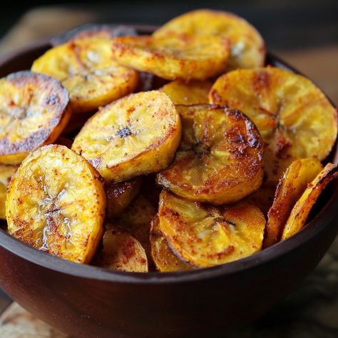 🌟 Crisp, savory Caribbean Plantain Chips are a must-try snack! 🍌✨ #CaribbeanFlavors #PlantainChips Caribbean Plantain Chips Ingredients: Green plantains (2, peeled and thinly sliced) Olive oil (2 tbsp) Salt (1 tsp) Paprika (1/2 tsp, optional) Instructions: Preheat oven to 375°F (190°C). Toss plantain slices with olive oil and salt. Arrange in a single layer on a baking sheet. Bake for 20-25 minutes until golden and crispy. Sprinkle with paprika if desired. 🌟 Enjoy these crunchy, tasty chi... Green Plantains, Instagram Recipes, Plantain Chips, Twisted Recipes, Trending Recipes, Baking Sheet, Tasty Dishes, Olive Oil, Food Photography