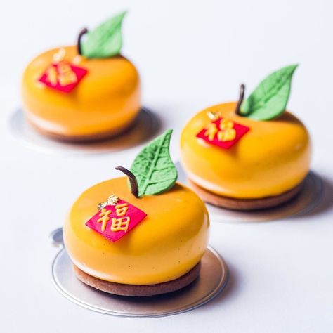 Chinese new year special! Mandarin-orange speculos reconstitued orange glaze and almond sablé #chinesenewyear #cny2016 #cnygrandhyatttaipei #grandhyatttaipei #baguettecakeshop #petitgateau #orangemousse #fu #pastrychef #pastrylife #chefstalk @grandhyatttpe @grandhyatt by julien_perri Lunar New Year Food Photography, Chinese New Year Photography Food, Chinese New Year Macaron, Chinese New Year Food Photography Style, Chinese Dessert Photography, New Year Cake Decoration, Chinese New Year Desserts, Chinese New Year Cake, Chinese Birthday