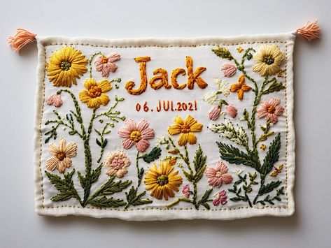 This baby embroidery banner, carefully made to welcome the arrival of a newborn, is full of warmth and joy. The banner is made of soft and comfortable fabric, and the edges are also decorated with delicate lace, adding a bit of elegance and sophistication. In the center, the baby's name is embroidered in warm and soft colors, and the font is smooth and loving. It is not only a beautiful confirmation of the identity of the newborn, but also the family's infinite expectations and blessings for her Floral Embroidery With Name, Newborn Embroidery Ideas, Name Embroidery Ideas, Embroidery Banner, Embroidered Banner, Baby Name Embroidery, Baby Reception, Newborn Embroidery, Embroidery Wall Hanging