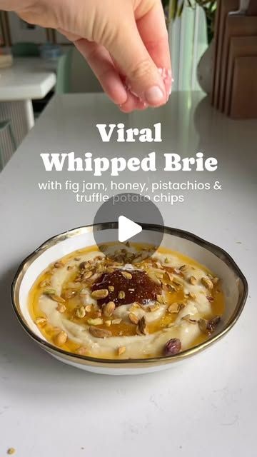 MacKenzie Smith on Instagram: "Finally got around to trying @ainttooproudtomeg’s viral whipped brie and it’s so fun! I topped mine with fig jam, honey and salty pistachios and served ‘em with truffle potato chips from Trader Joe’s. Can’t wait to do it with guava and toasted macadamia nuts next 😍

Comment “Honey Baby” to get the full recipe sent straight to your inbox! 

⭐️ 2 8 oz wheels Brie Cheese
⭐️ 3 tablespoons Honey, divided
⭐️ 2 tablespoons Fig Jam
⭐️ 1 tablespoon Toasted Pistachios, roughly chopped
⭐️ 1 pinch Flaky Salt

* Using a sharp knife or cheese slicer, carefully remove the rind from your chilled brie. It’s easiest to do this when the cheese is very cold. 
* Now use your hands to tear up the brie then add it to a food processor, electric mixer,  or the bowl of a stand mixer Whipped Brie, Oz Wheels, Truffle Potato Chips, Mackenzie Smith, Cheese Slicer, Flaky Salt, Sharp Knife, Fig Jam, Brie Cheese