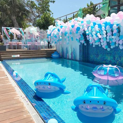 A view of the pool which we turned into a magical shark reef 🦈💕 with baby shark and jelly fish pool floats, magical seahorses and glittered… Shark Pool, Fish Pool, Mermaid Pool Parties, Mermaid Pool, Ocean Birthday Party, Mermaid Birthday Party Decorations, Ocean Birthday, Girl Bday Party, Pool Party Decorations